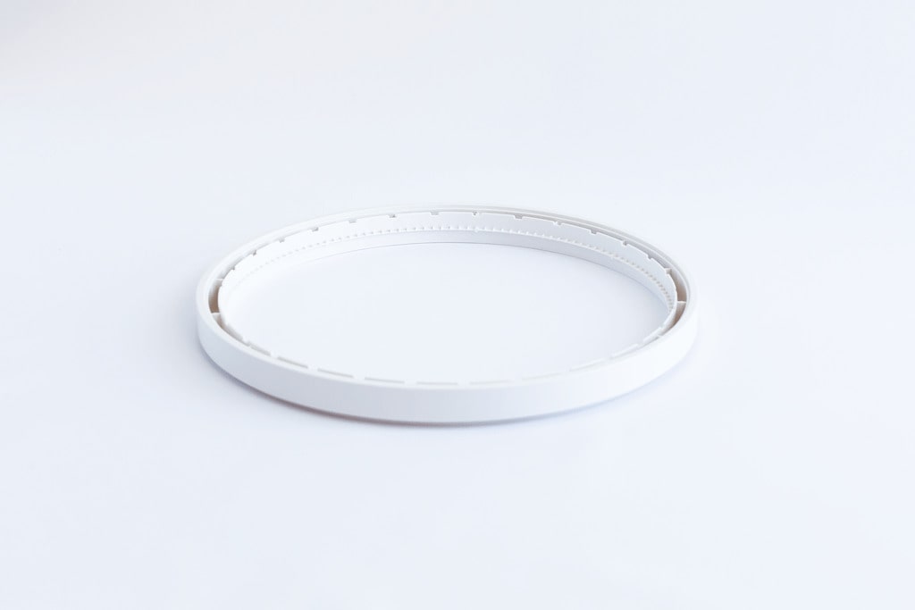 A white Ezidri Ultra FD1000 Spacer Ring.